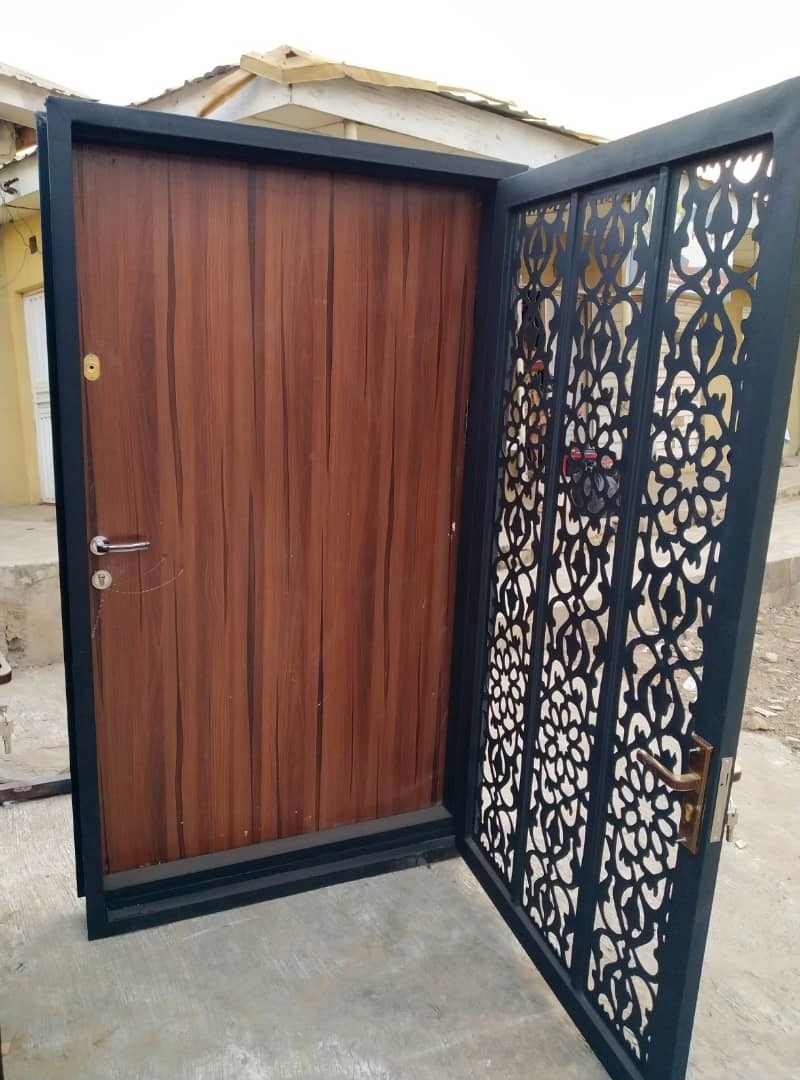 Custom laser-cut security door with ornate design
